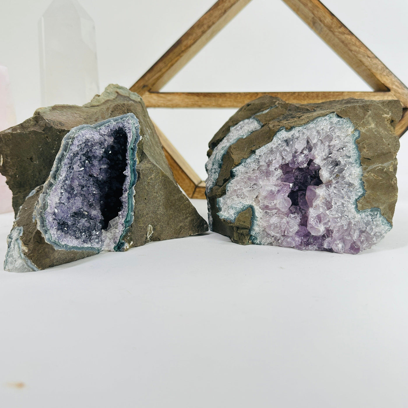 amethyst cluster with decorations in the background