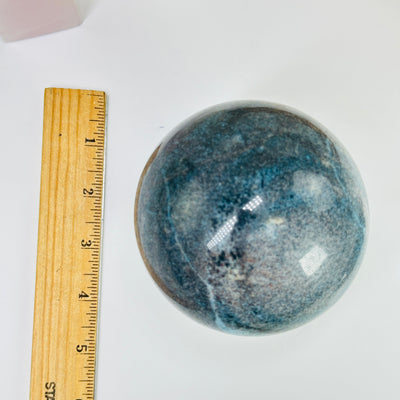 Trolleite sphere next to a ruler for size reference