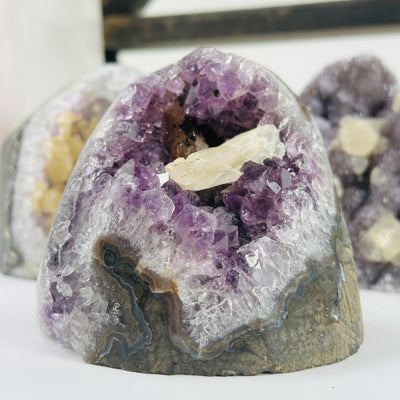 amethyst cut base with decorations in the background