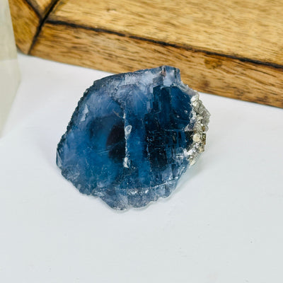 blue fluorite with decorations in the background