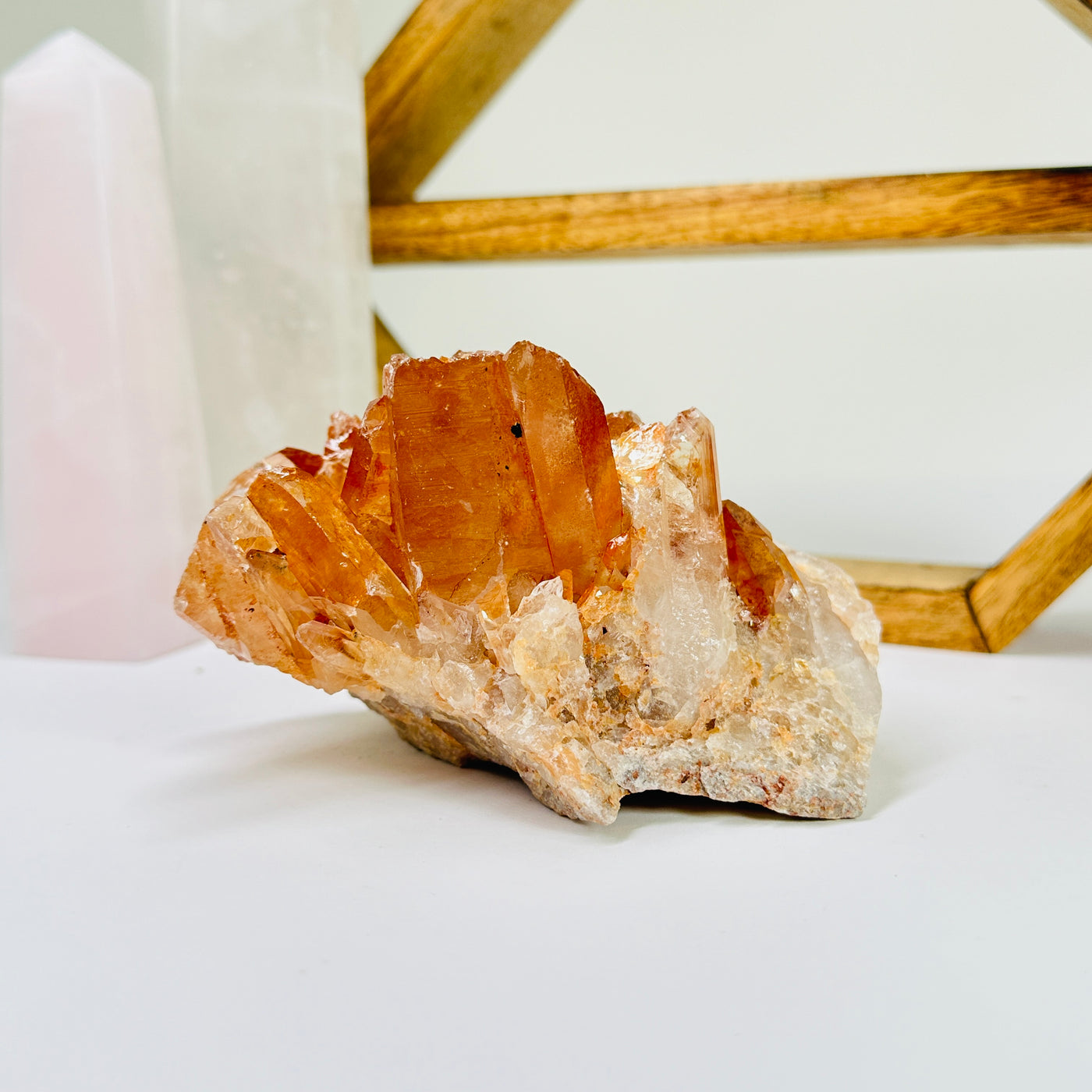 tangerine quartz with decorations in the background