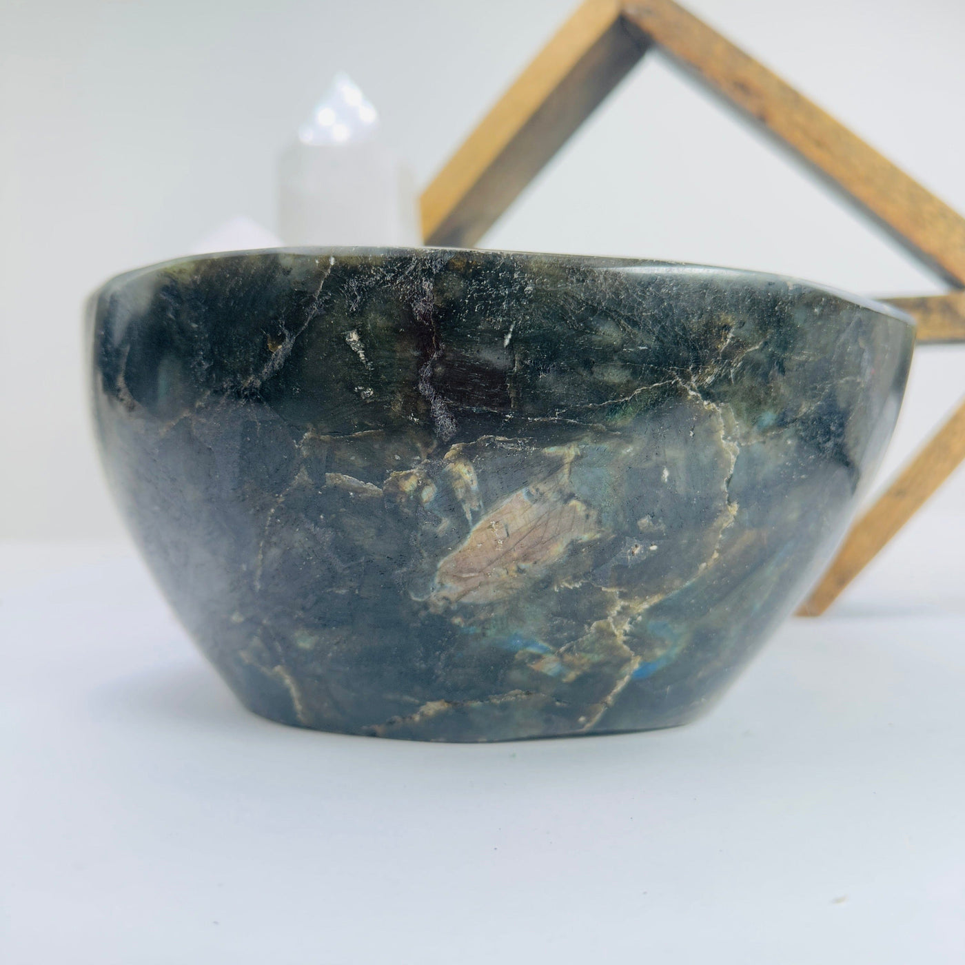 labradorite bowl with decorations in the background