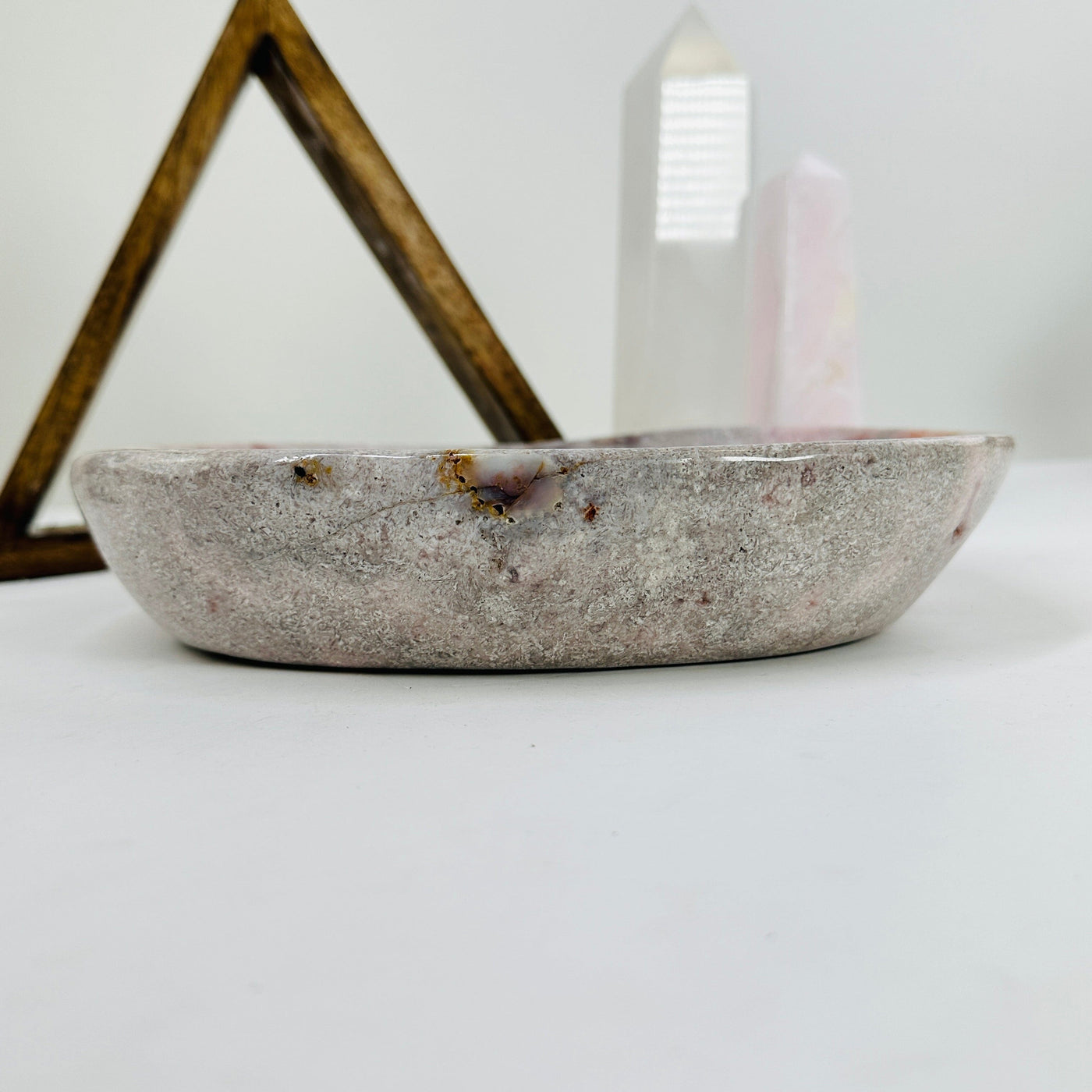 pink amethyst bowl with decorations in the background