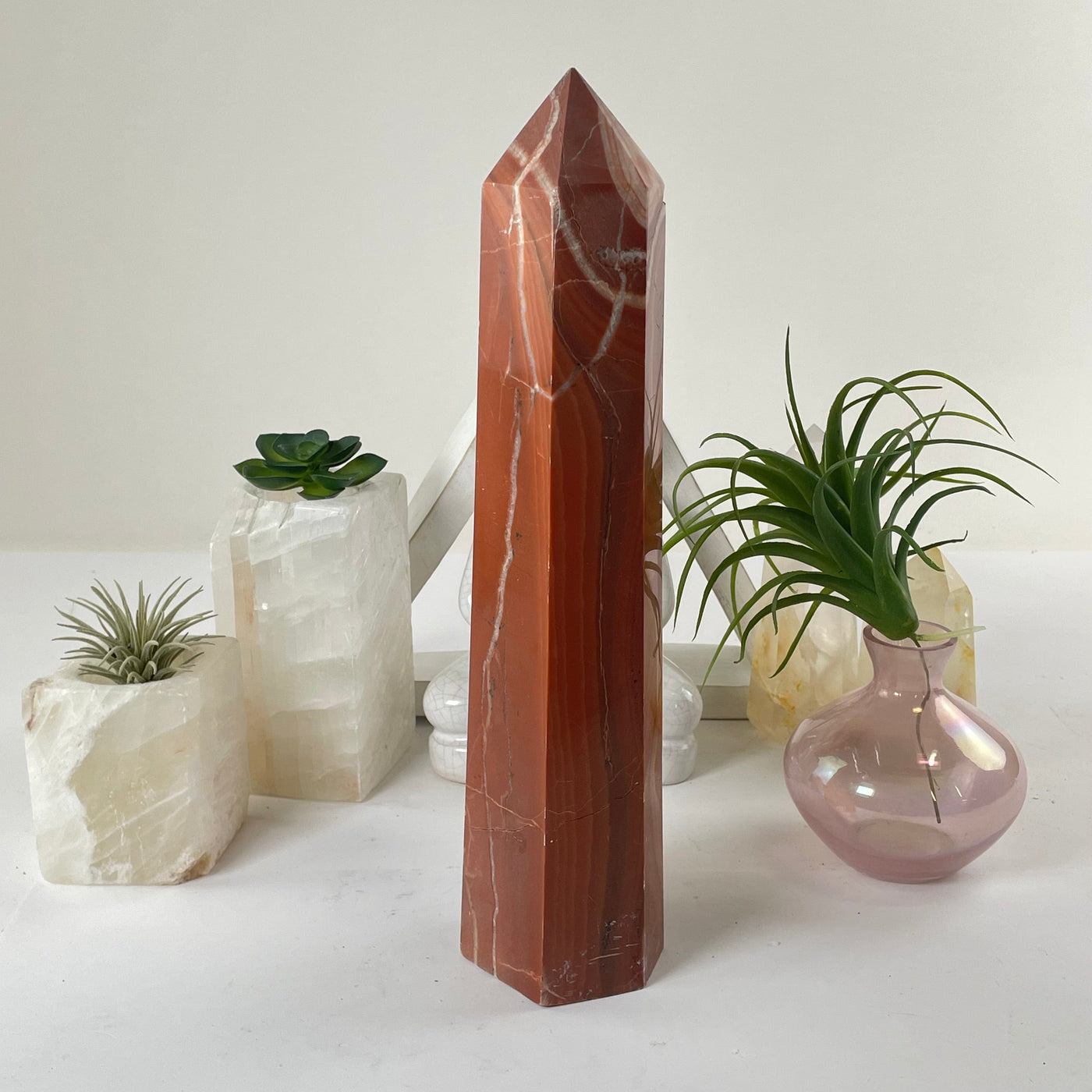 Red Jasper Crystal Obelisk on diplay showing another side
