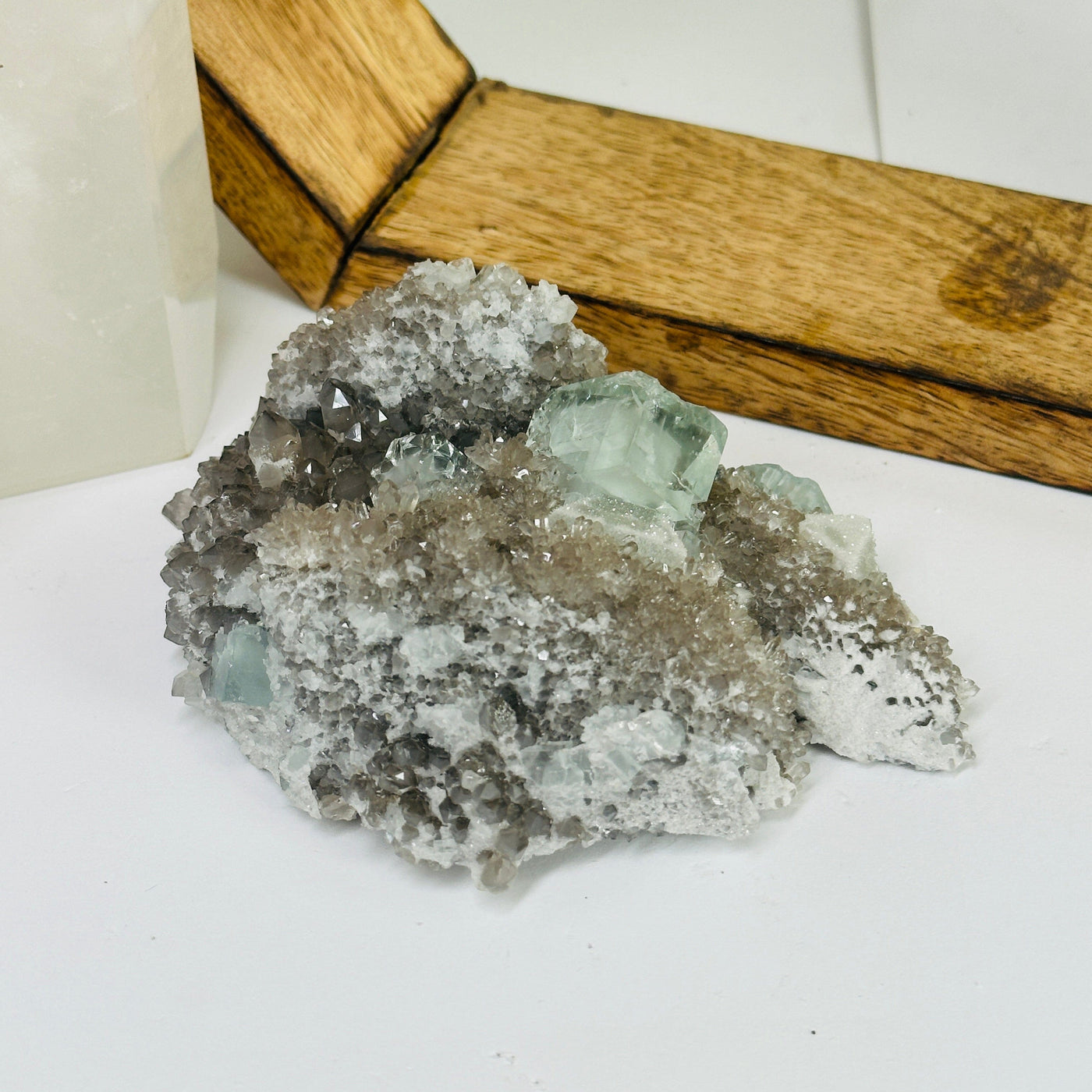 Blue fluorite crystal with decorations in the background