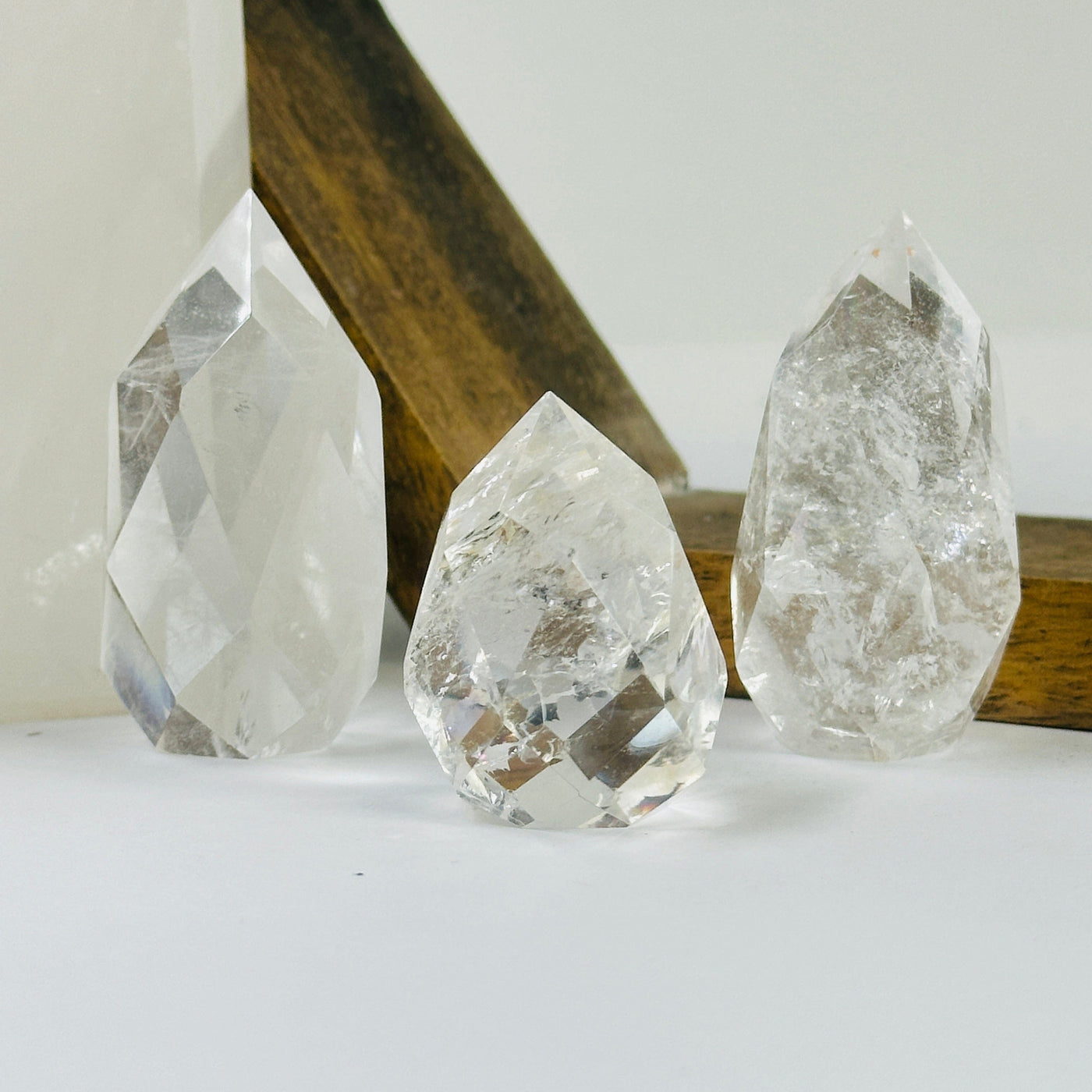 crystal quartz point with decorations in the background