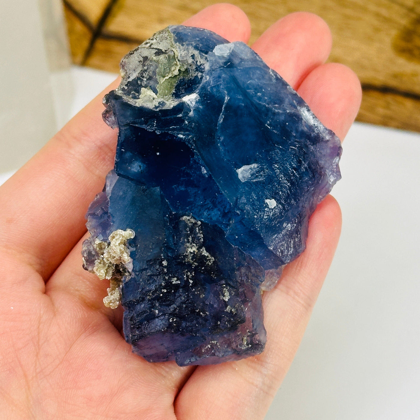 blue fluorite with decorations in the background