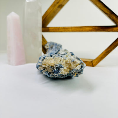 kyanite with decorations in the background