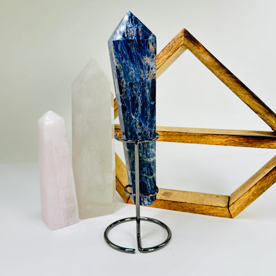 sodalite wand with decorations in the background