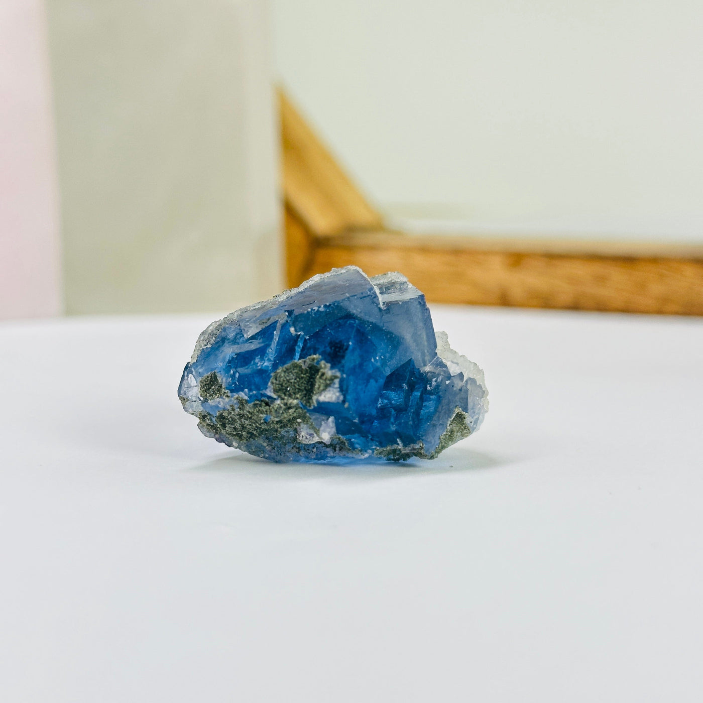 blue fluorite with decorations in the background