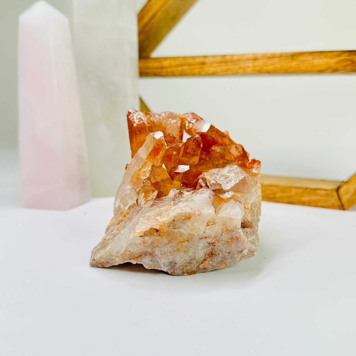 tangerine quartz with decorations in the background