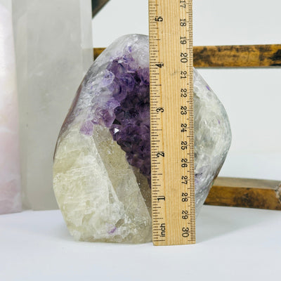 amethyst cut base next to a ruler for size reference