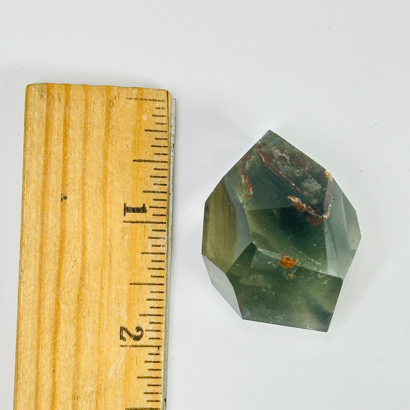 garden quartz next to a ruler for size reference