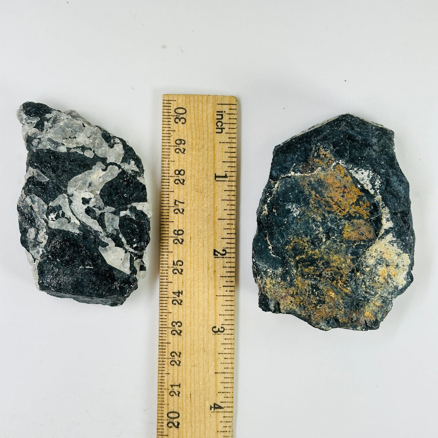 tourmaline cluster next to a ruler for size reference