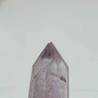 up close shot of chip on tip of amethyst wand