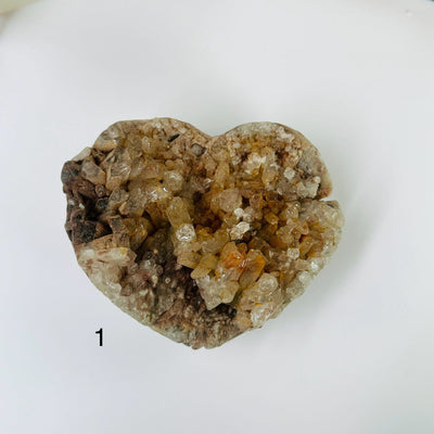 tangerine quartz hearts with decorations in the background