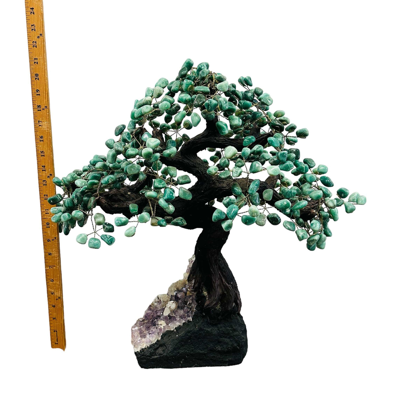 green aventurine tree on amethyst stand next to a ruler for size reference