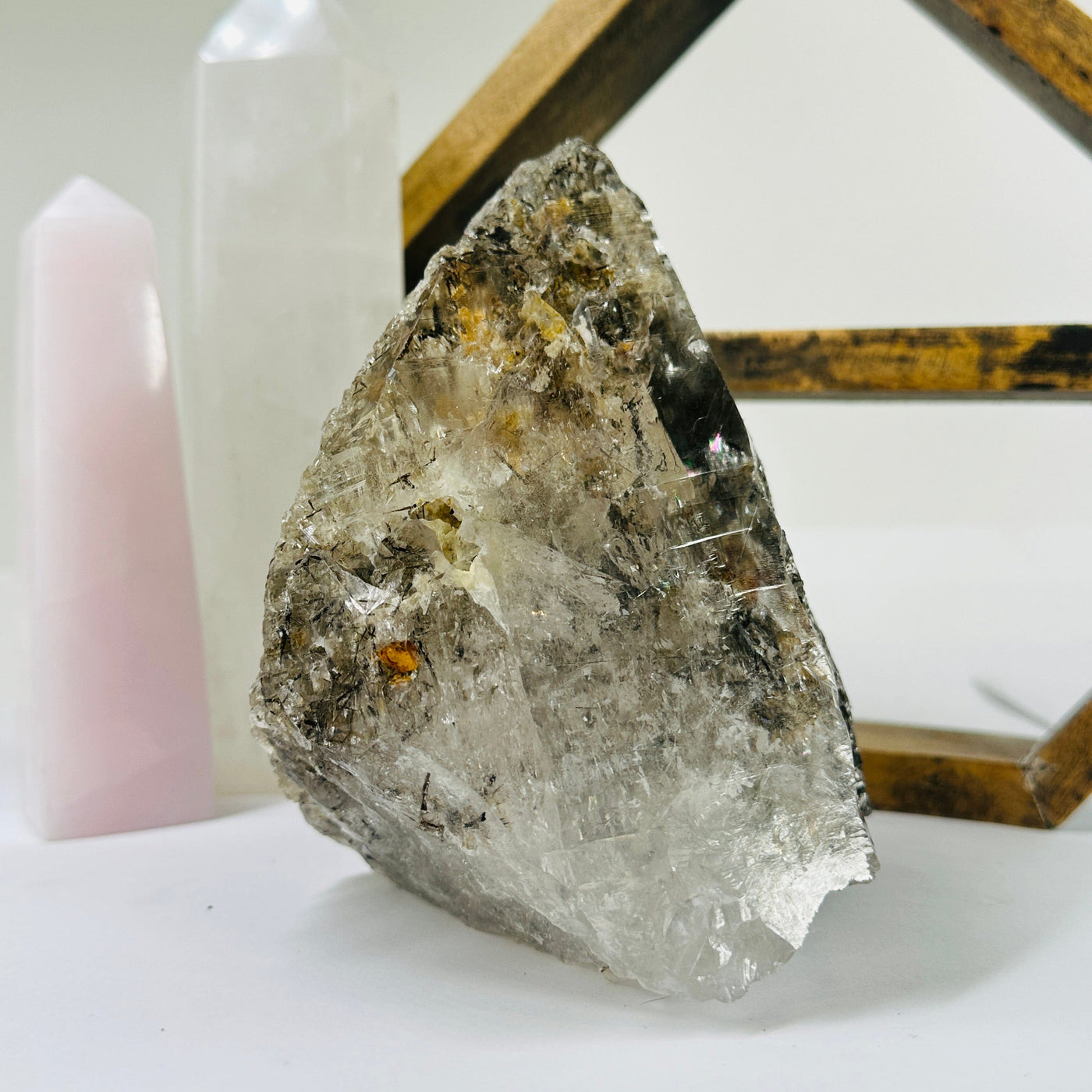 rutilated quartz with decorations in the background