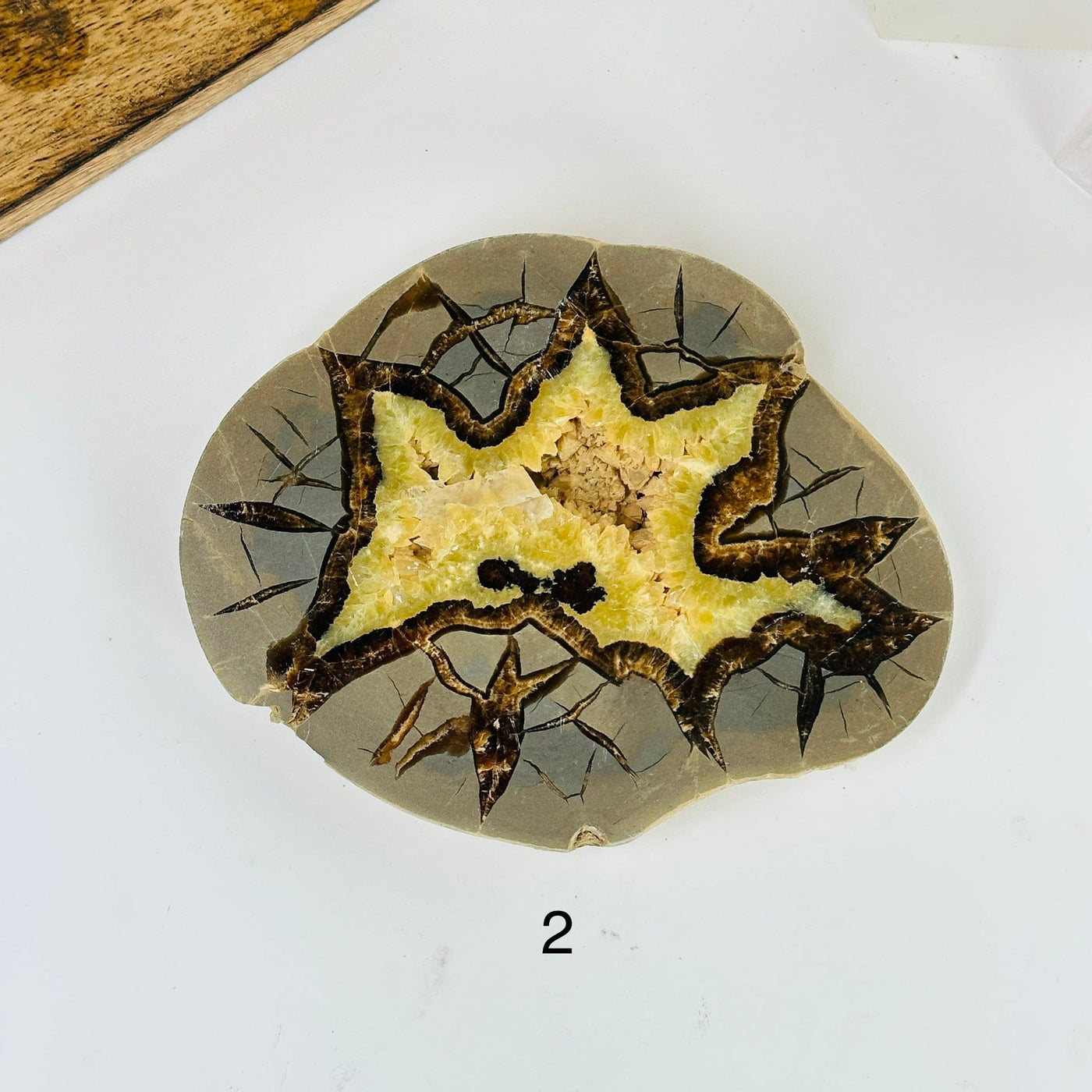 Septarian platter with decorations in the background 