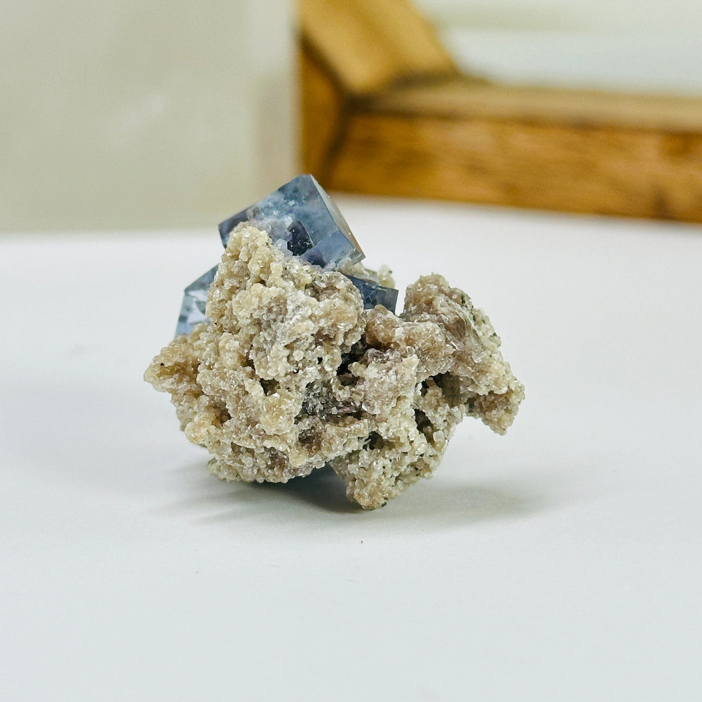 blue fluorite with decorations in the background