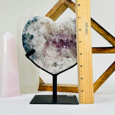 amethyst HEART next to a ruler for size reference