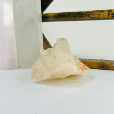 lemurian tangerine quartz with decorations in the background