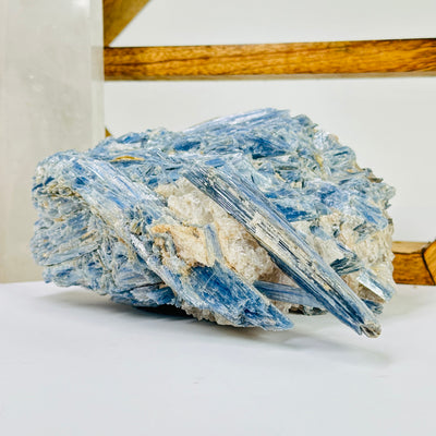 kyanite with decorations in the background