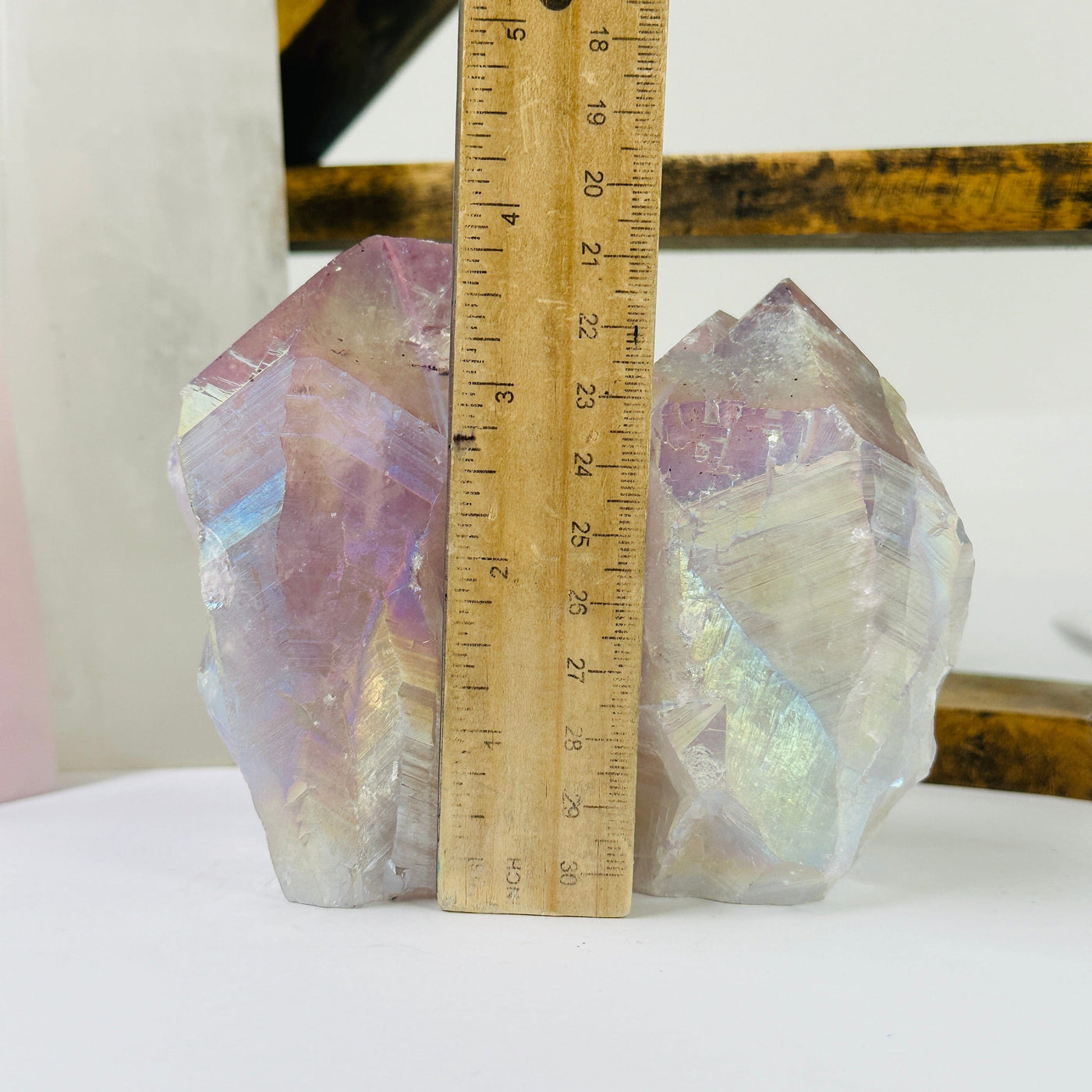 amethyst points next to a ruler for size reference