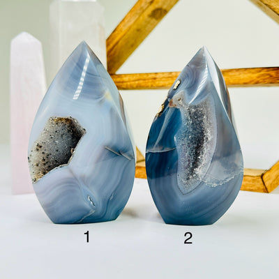 agate flame point with decorations in the background