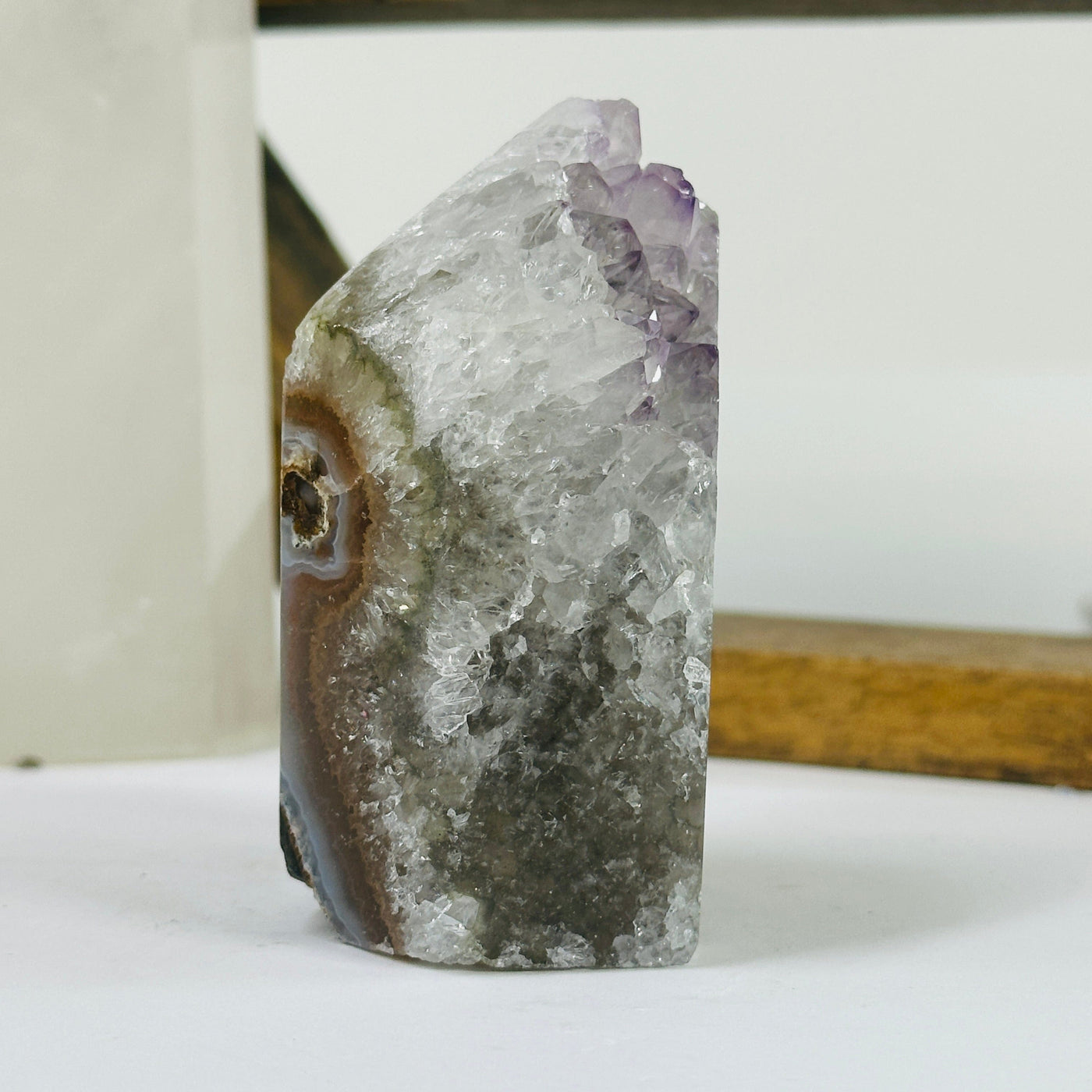 amethyst point with decorations in the background