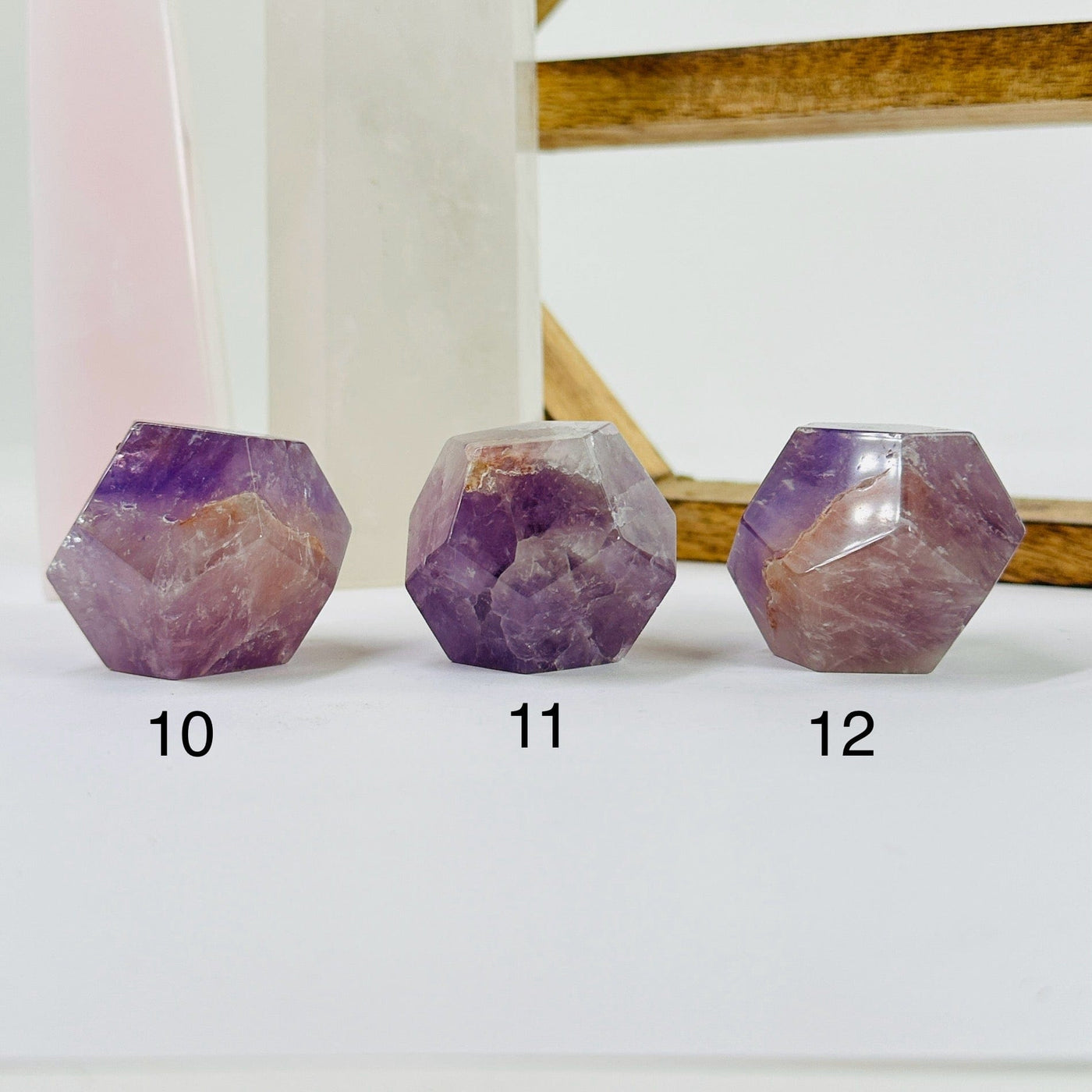 amethyst dodecahedron with decorations in the background