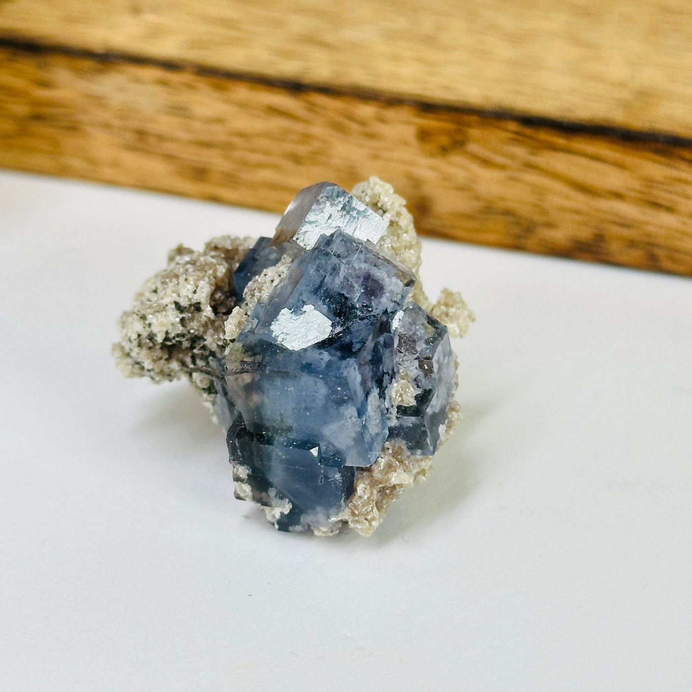 blue fluorite with decorations in the background