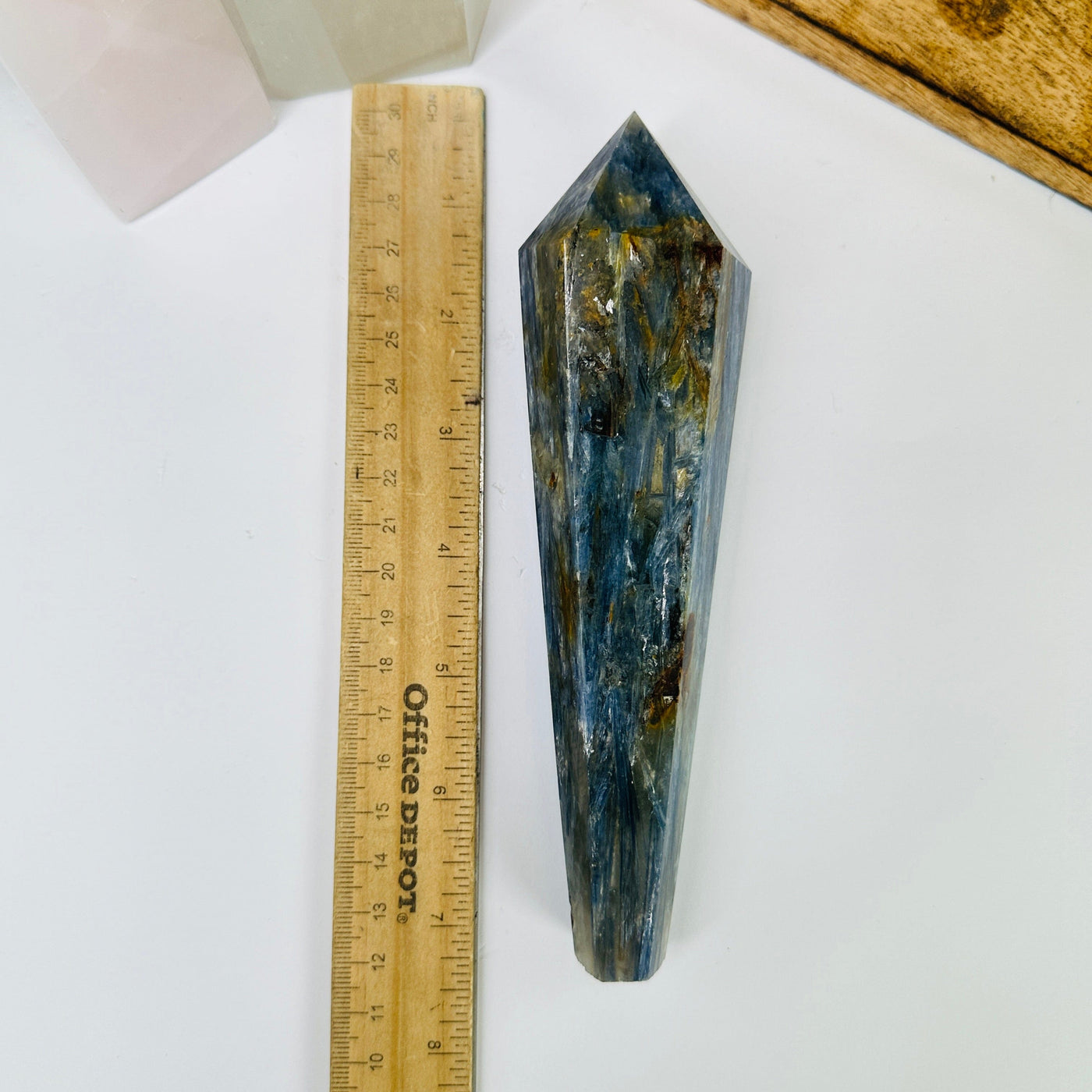 kyanite point next to a ruler for size reference