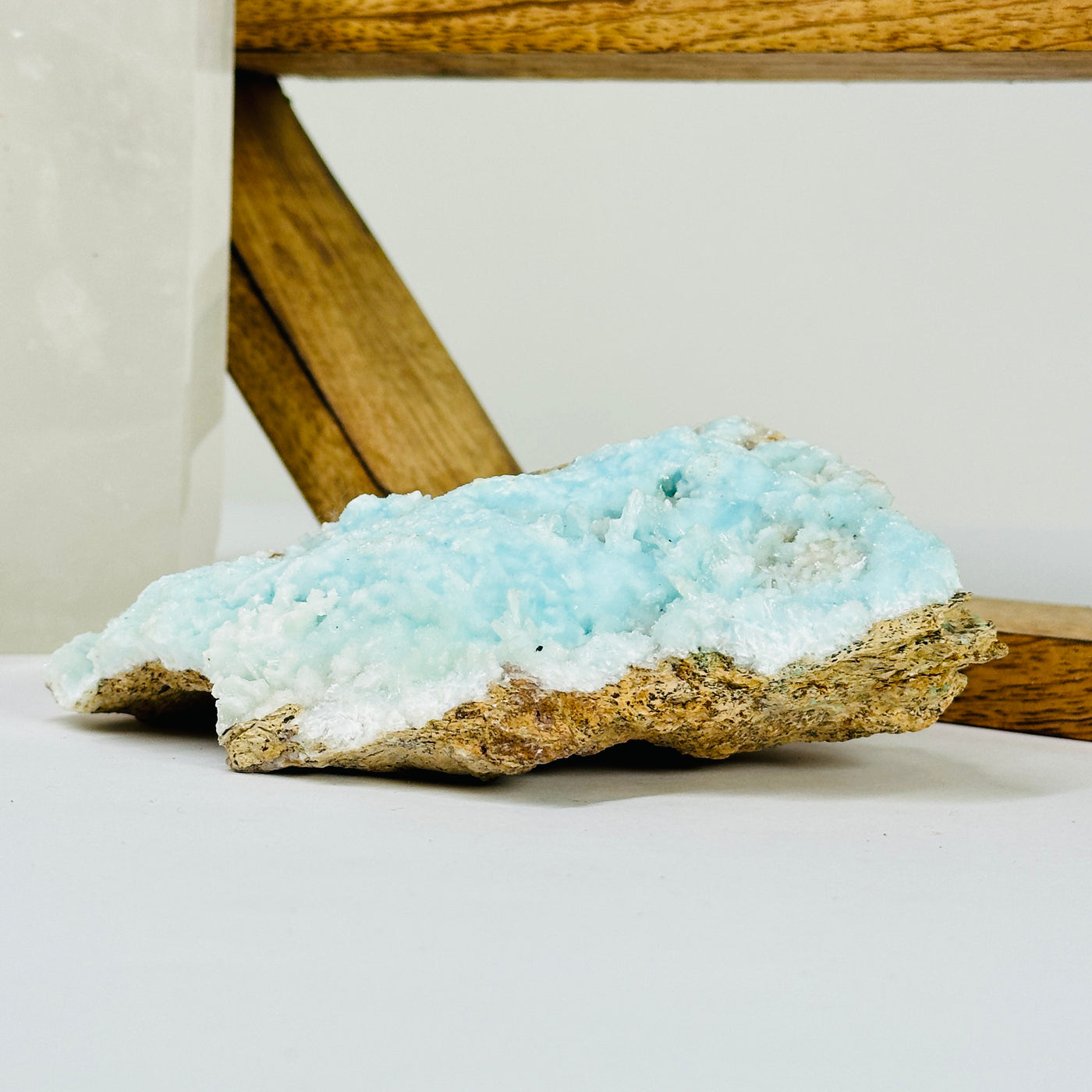 blue aragonite with decorations in the background