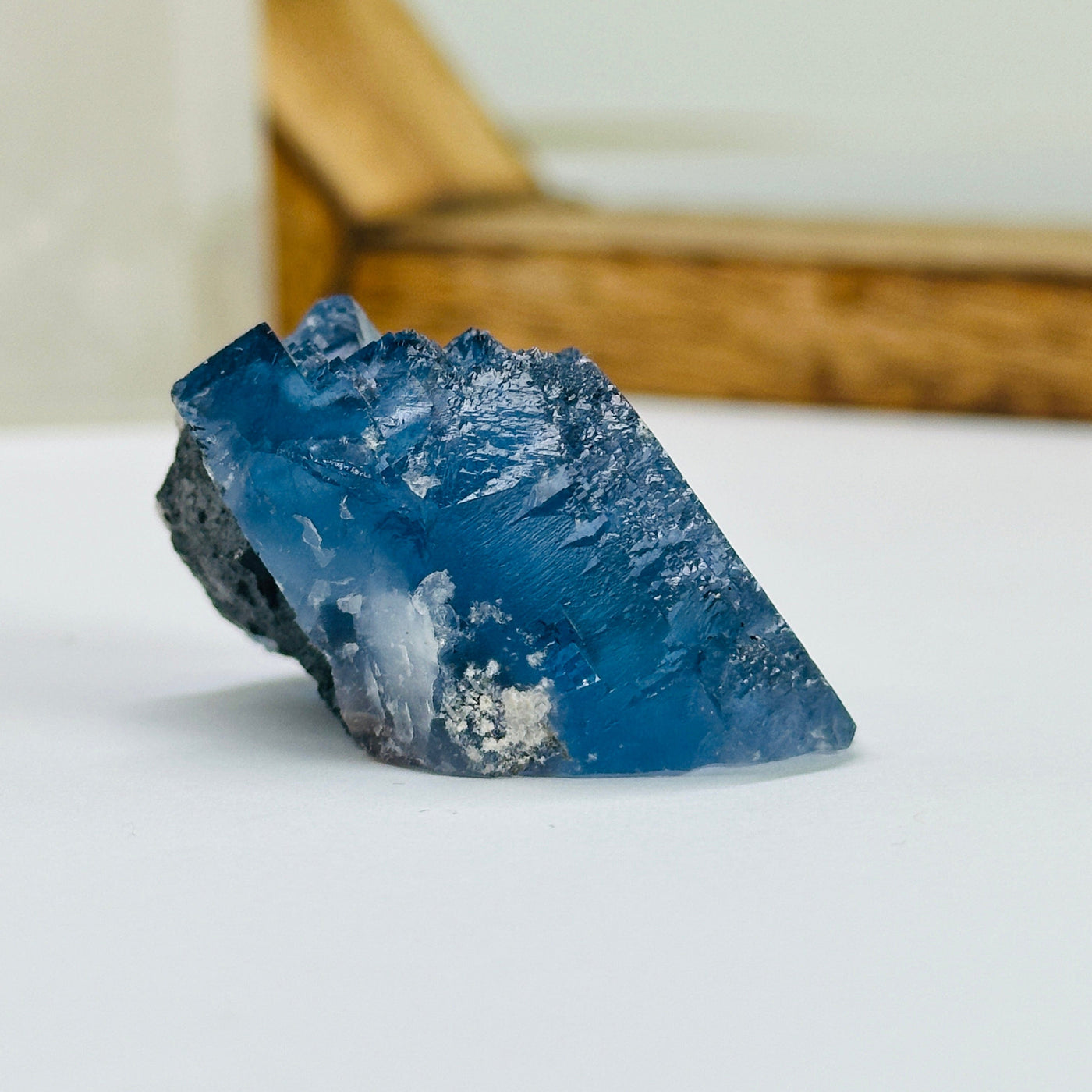 blue fluorite with decorations in the background