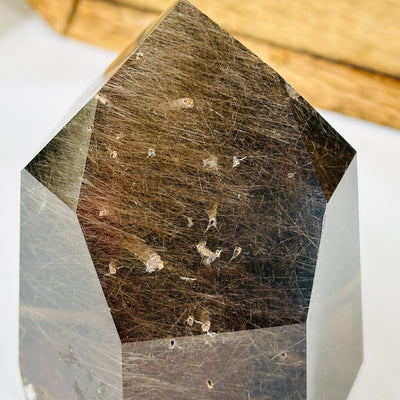 rutile quartz with decorations in the background