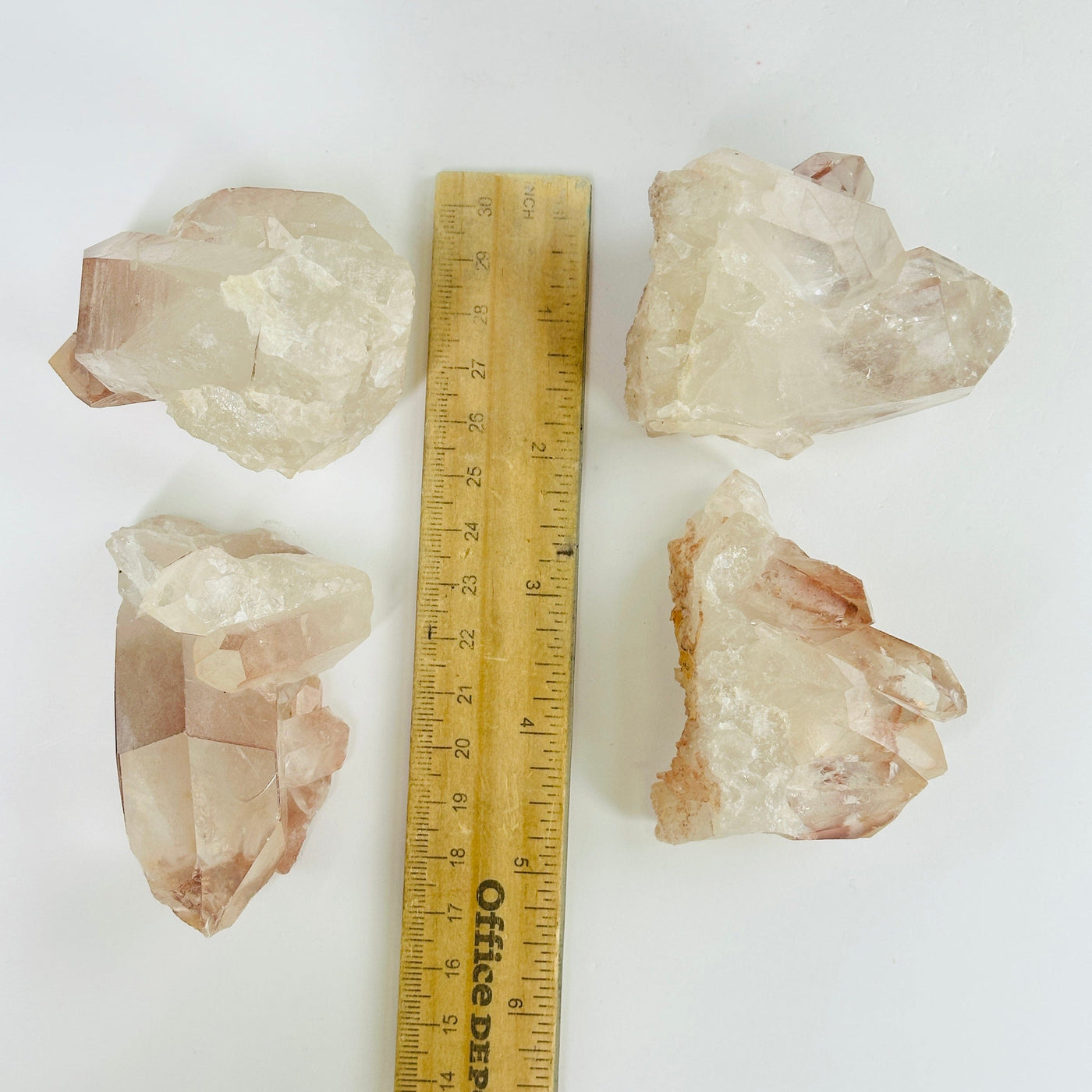 lithium quartz next to a ruler for size reference