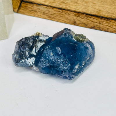 blue fluorite with decorations in the background