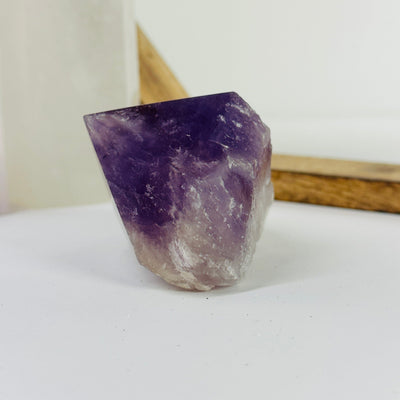 amethyst point with decorations in the background