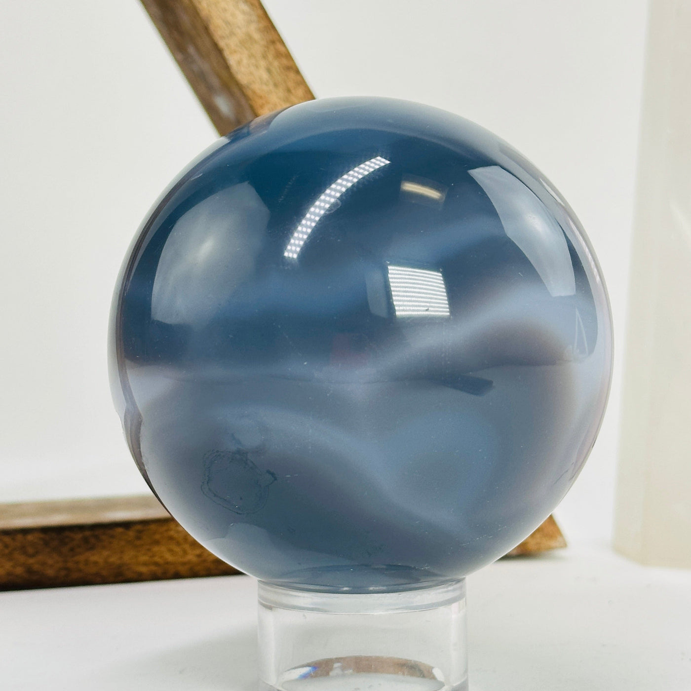 agate sphere with decorations in the background