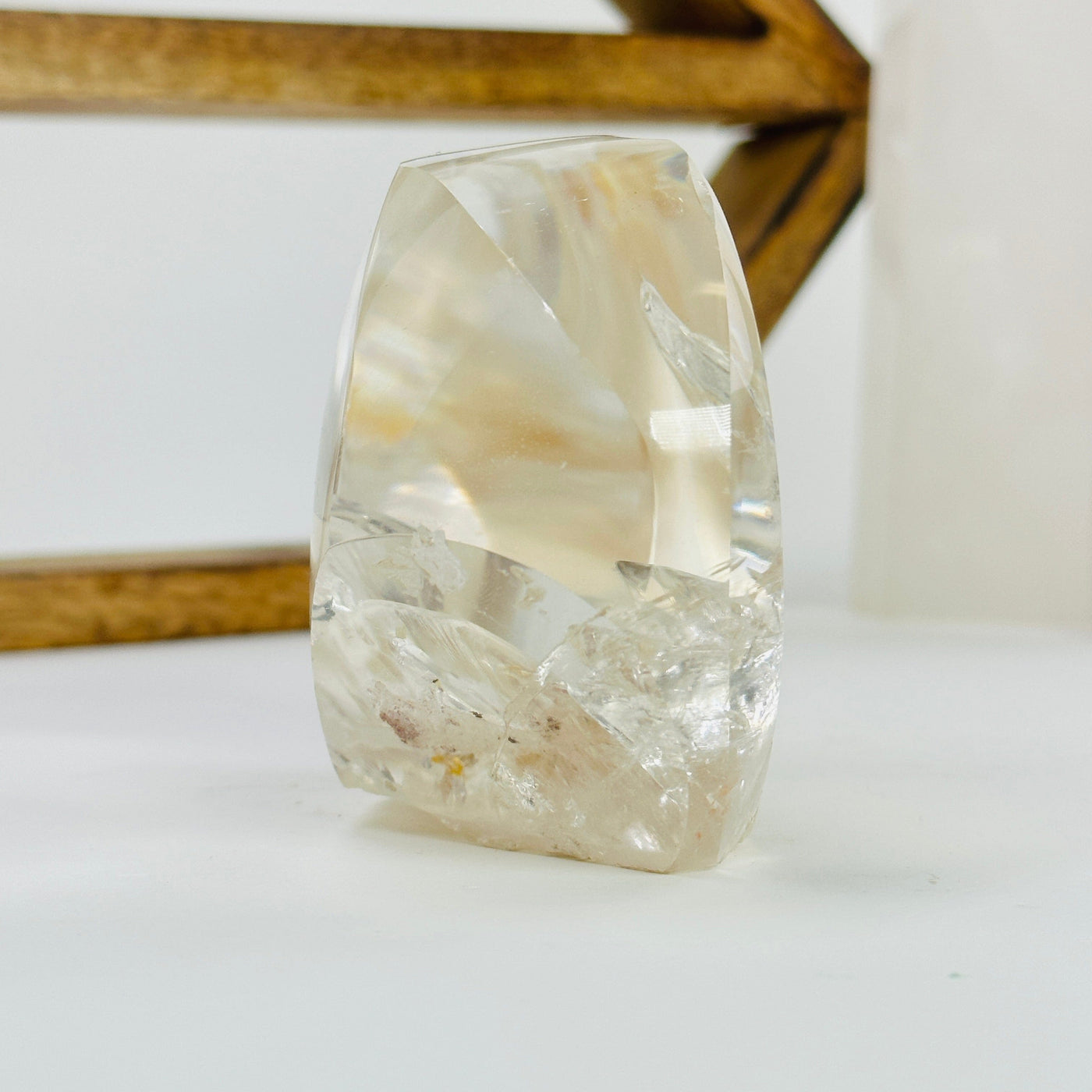crystal quartz with inclusions with decorations in the background