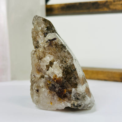 smokey quartz with decorations in the background