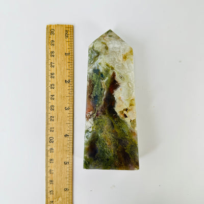 moss agate with decorations in the background