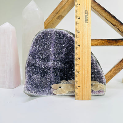 amethyst cut base next to  ruler for size reference