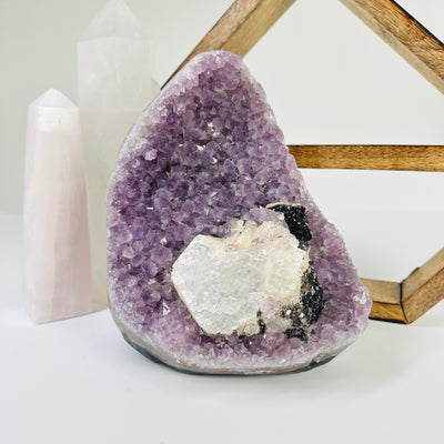 amethyst cut base with decorations in the background