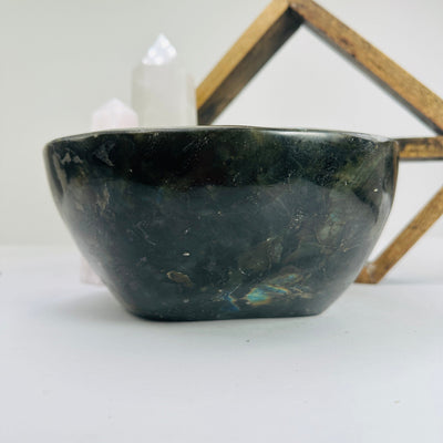 labradorite bowl with decorations in the background