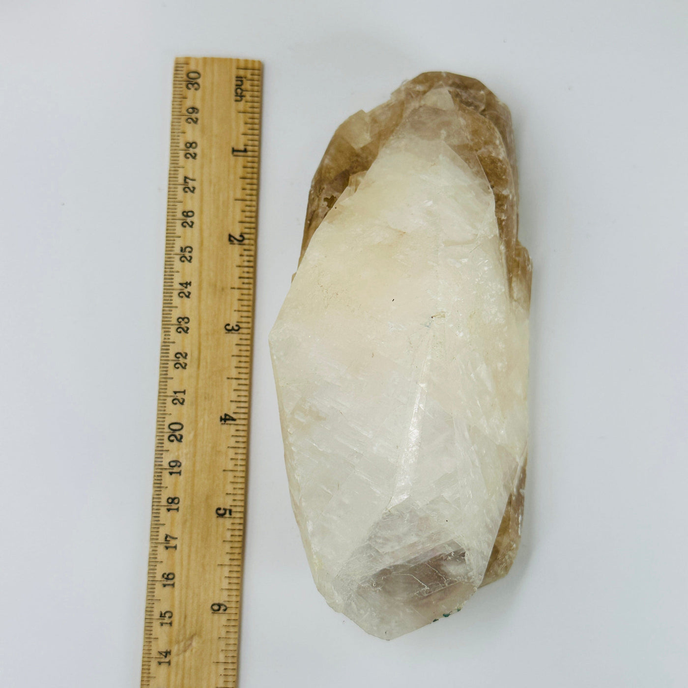 calcite cluster next to a ruler for size reference