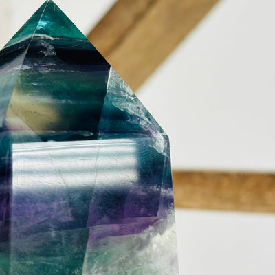 up close shot of chip on tip on fluorite point