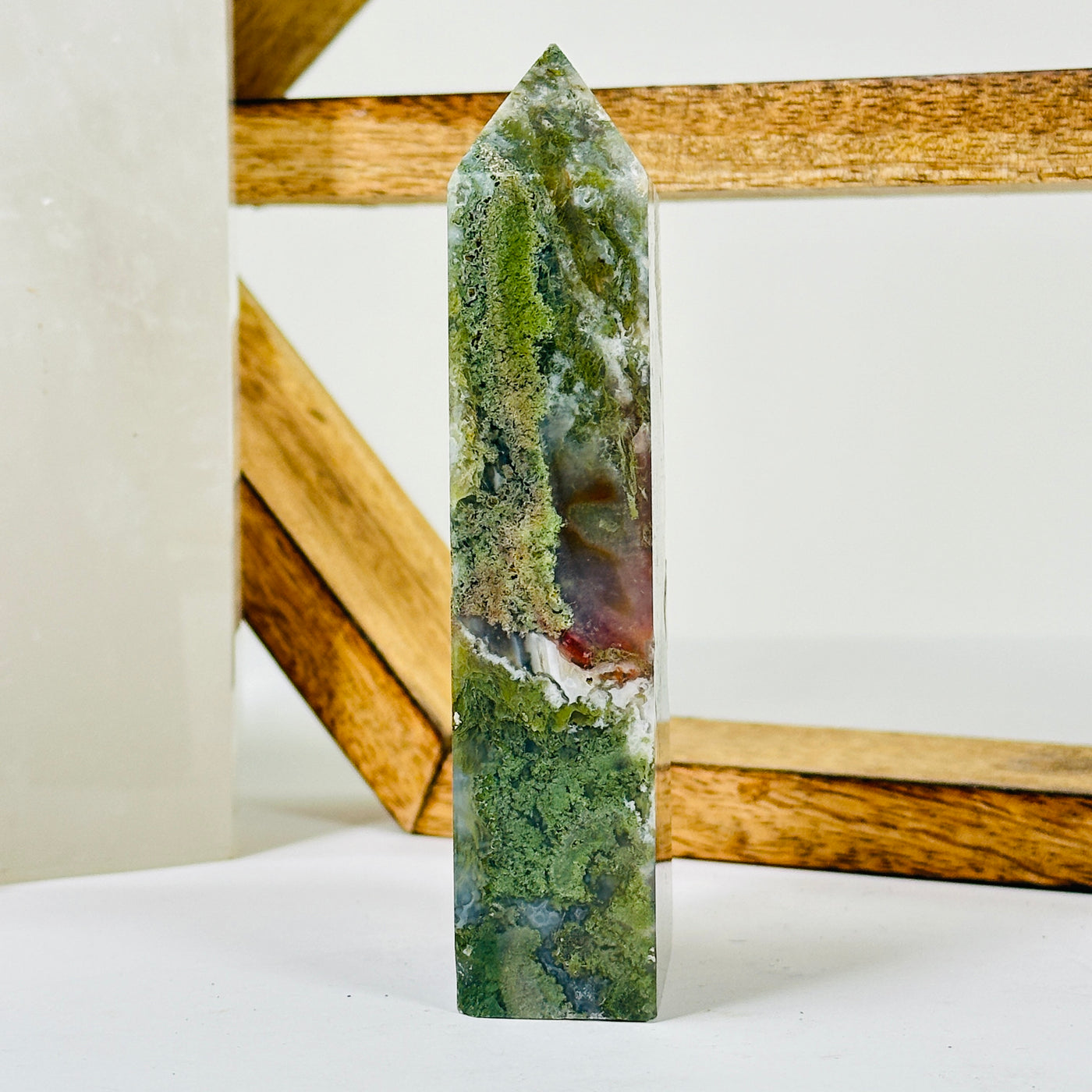 moss agate with decorations in the background