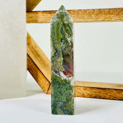 moss agate with decorations in the background